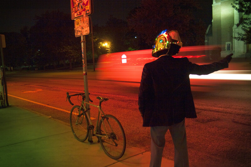 Person in helmet hailing a ride