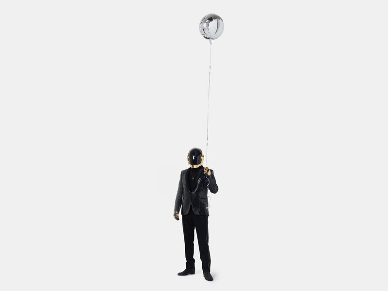 Person in Helmet Holding Balloon — Black