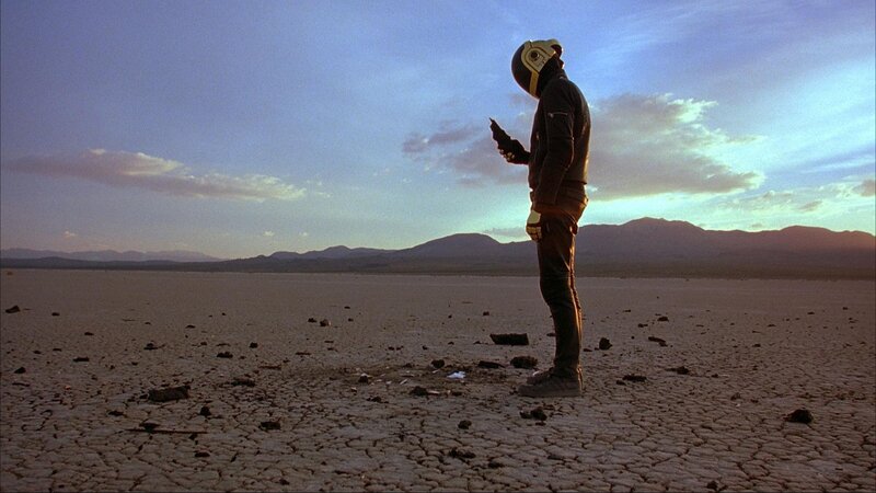 person in helmet on cracked earth