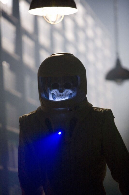person in helmet with skull visor