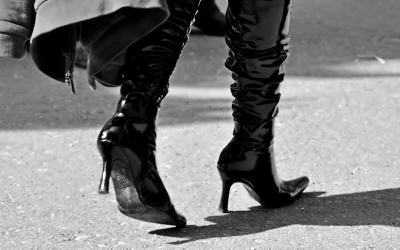 person in high-heeled boots