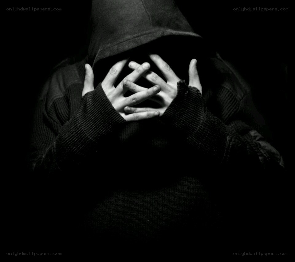 person in hood covering face