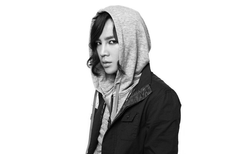 Person in Hooded Jacket — Black, Serious
