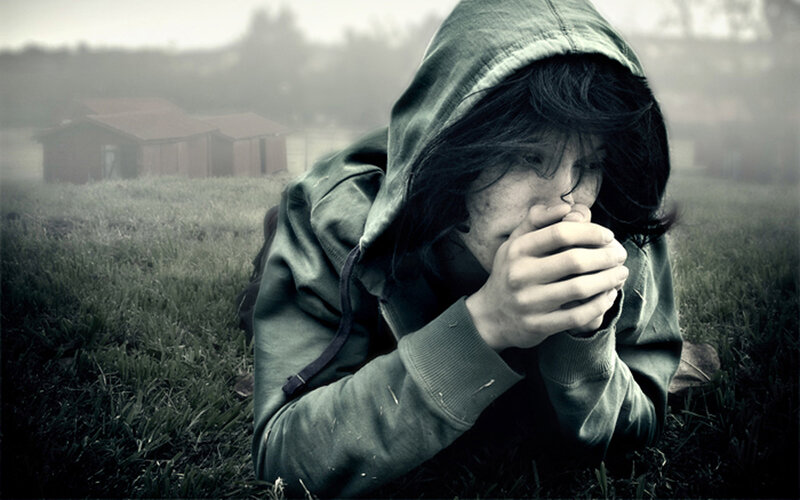 Person in Hooded Jacket — Green, Somber
