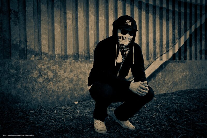 person in hooded outfit crouching