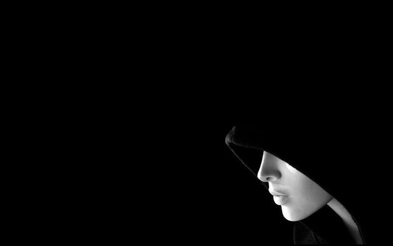 person in hooded silhouette