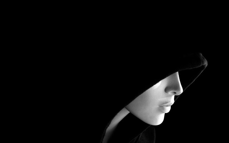 person in hooded silhouette