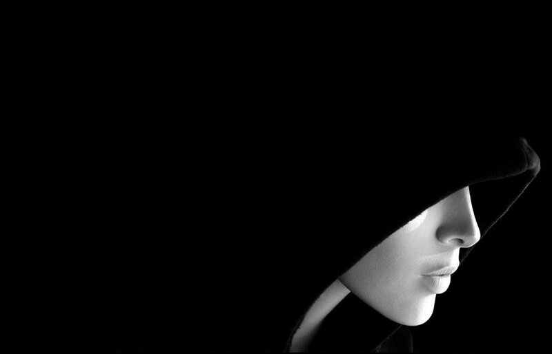 person in hooded silhouette
