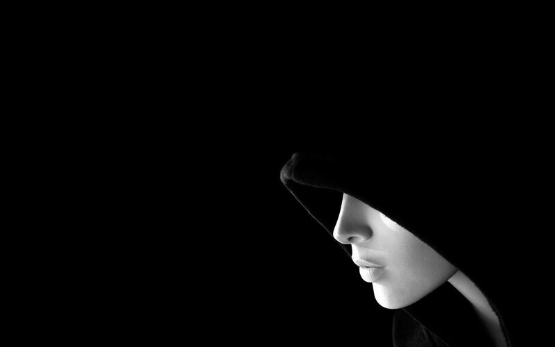 person in hooded silhouette
