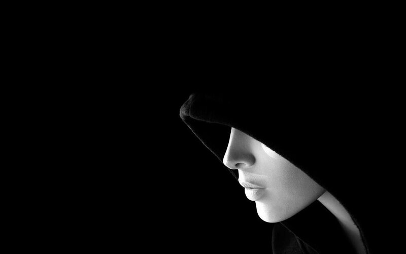 person in hooded silhouette