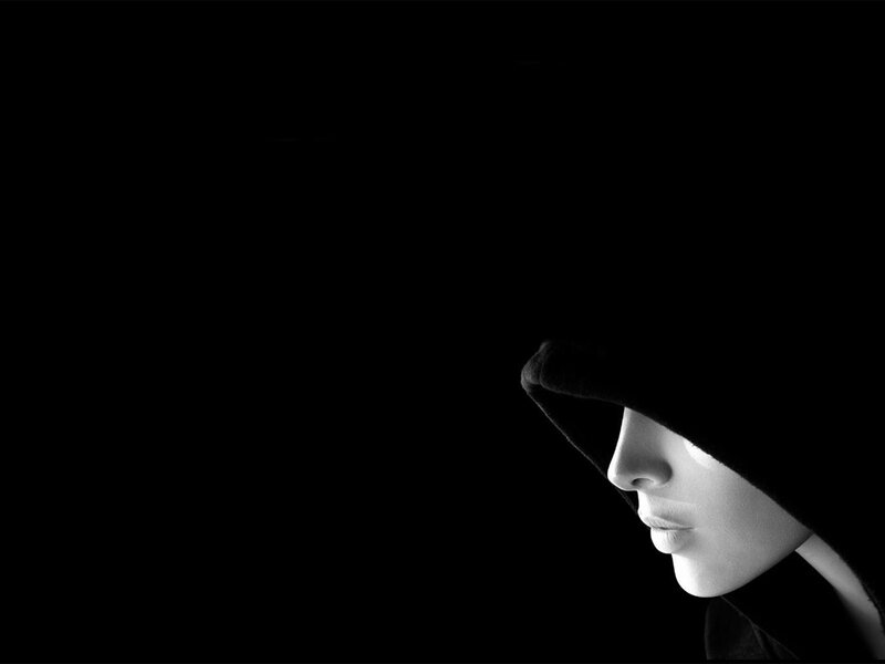 person in hooded silhouette