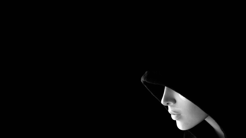 person in hooded silhouette