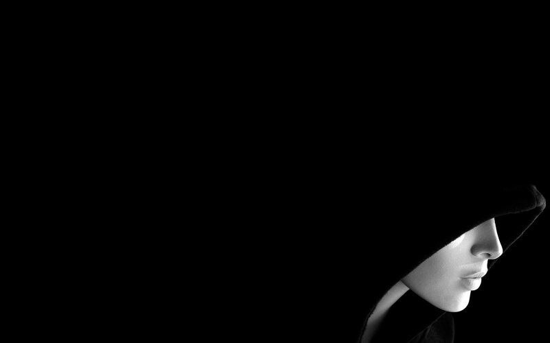 person in hooded silhouette