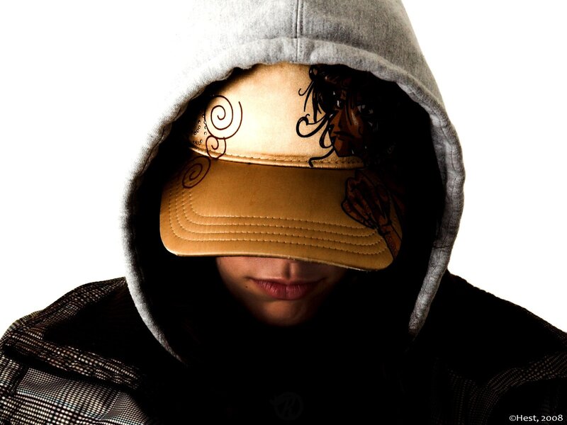 person in hoodie and cap