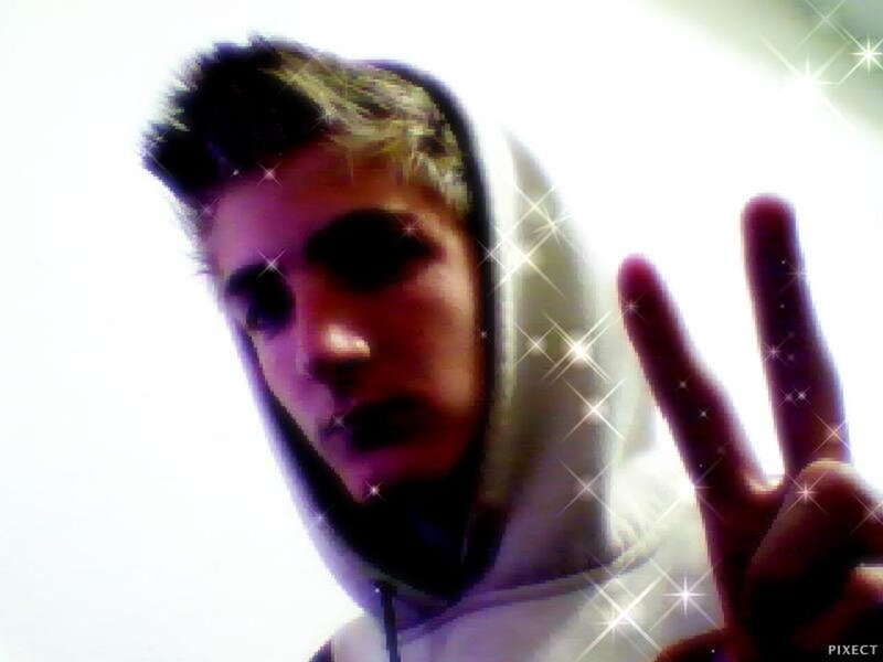 Person in Hoodie Making Peace Sign