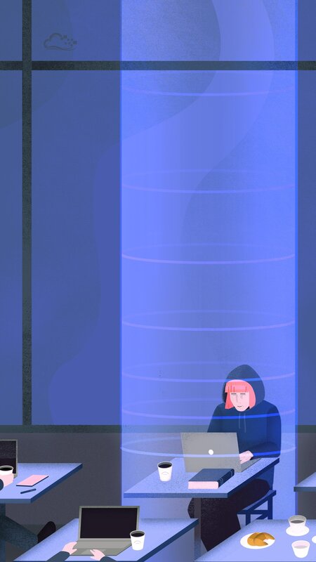 Person in Hoodie Using Laptop