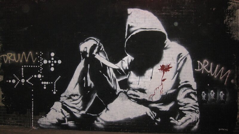 Person in Hoodie with Knife