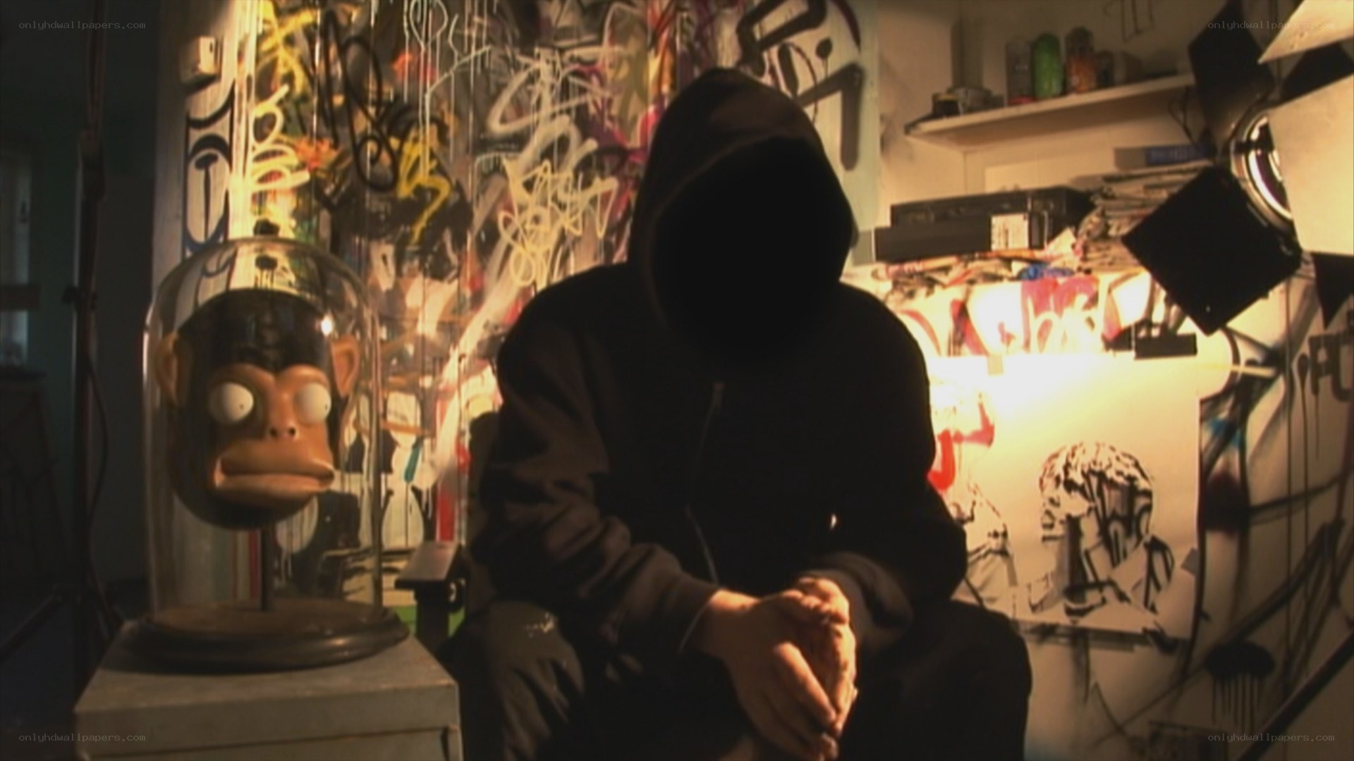 person in hoodie with monkey head
