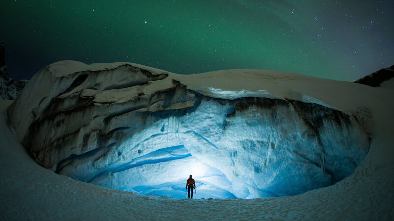 Person in Ice Cave — Green