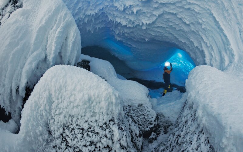Person in Ice Cave — White, Dramatic