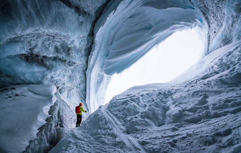 Person in Ice Cave — White, Dramatic, Winter, Photograph