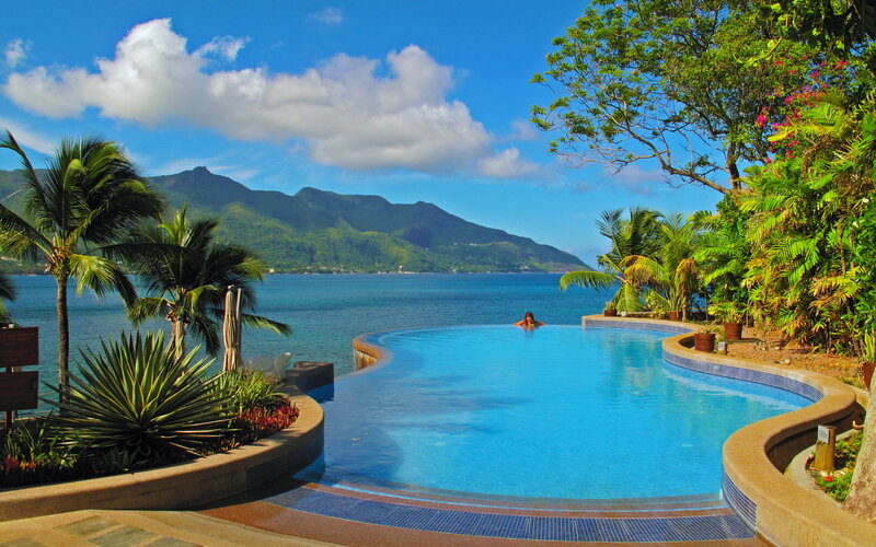 Person in Infinity Pool — Blue, Serene, Afternoon, Photograph