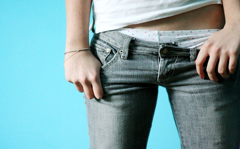 person in jeans and white shirt
