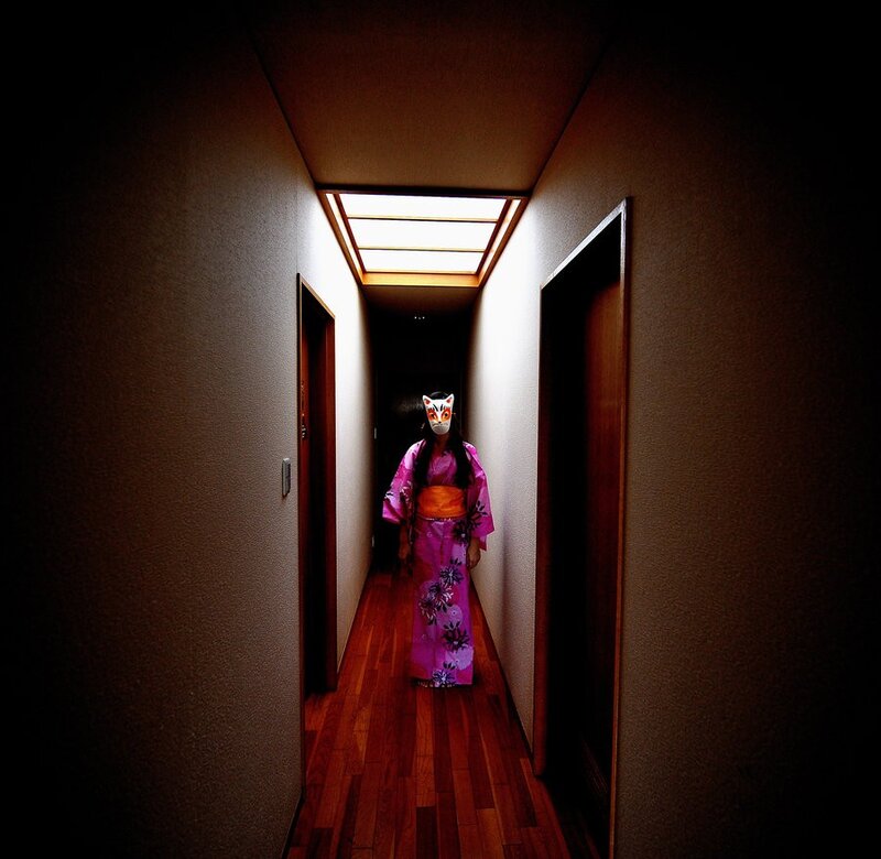 person in kimono with mask