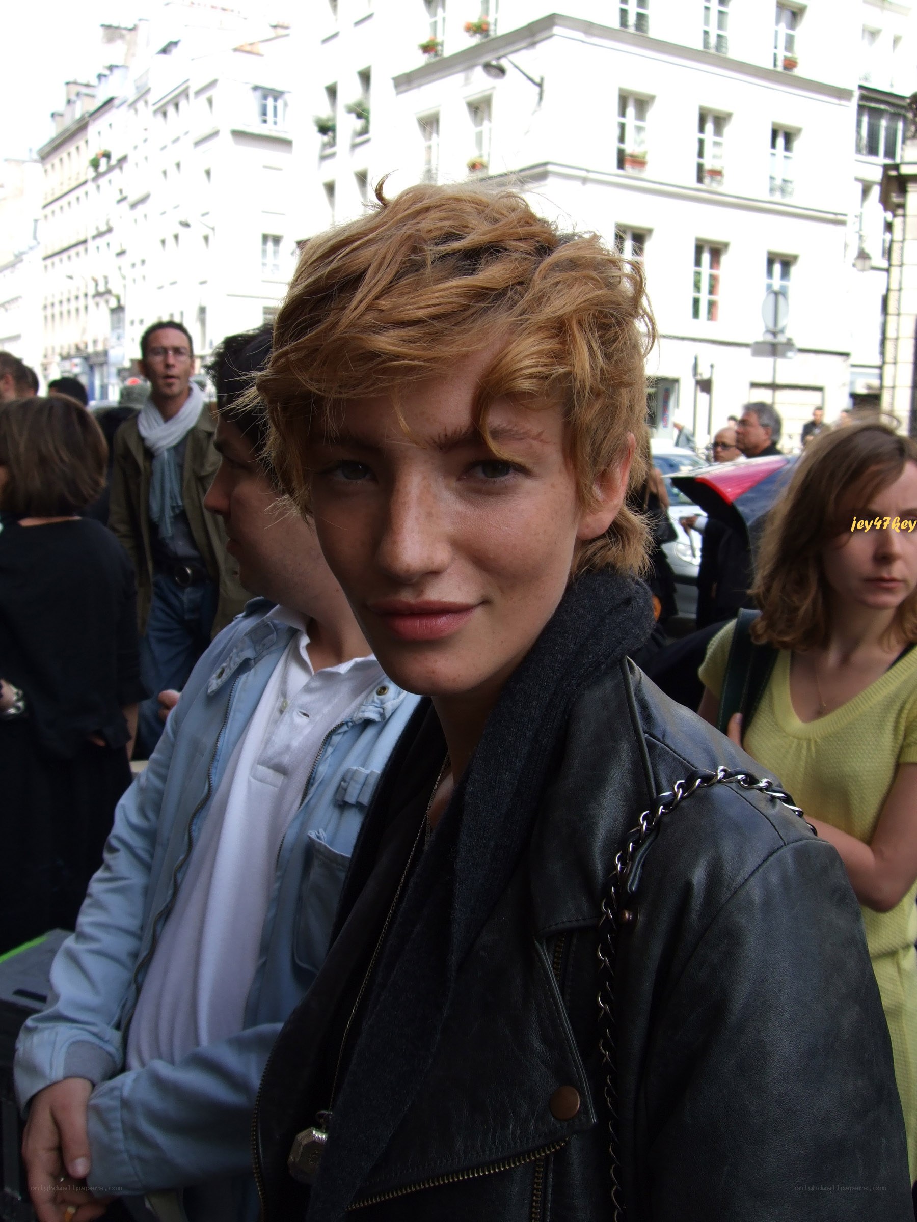 person in leather jacket on street