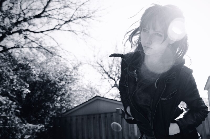 person in leather jacket outdoors