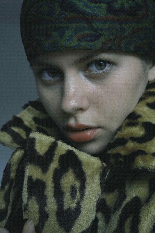 Person in Leopard Coat — Black