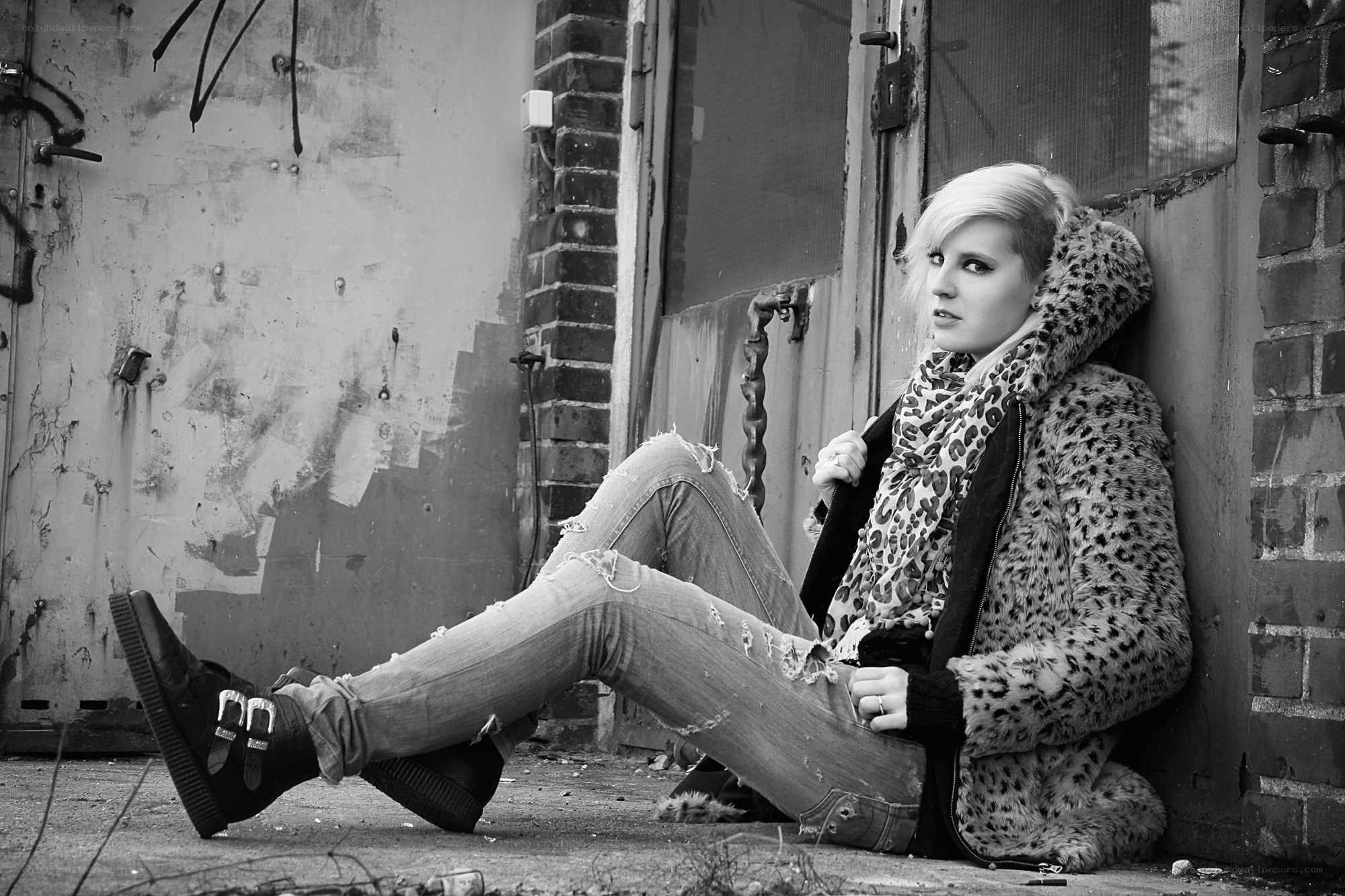 person in leopard coat sitting