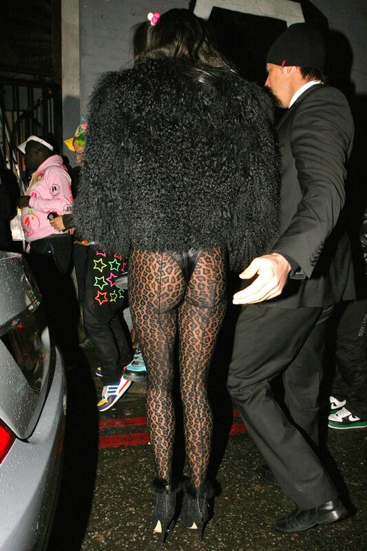 Person in leopard tights and fur coat