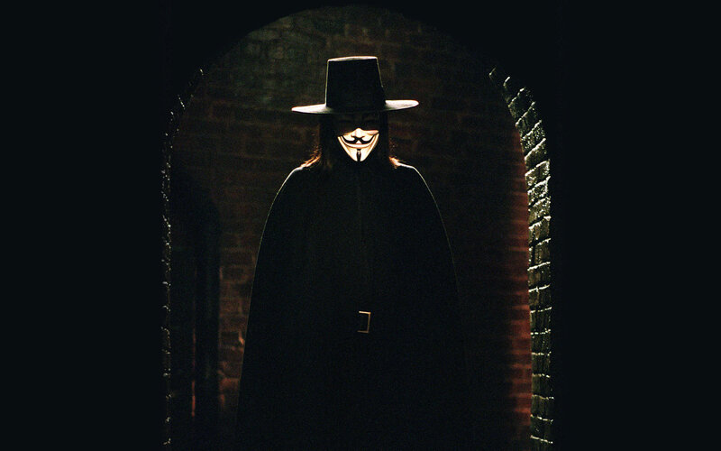 person in mask and cloak