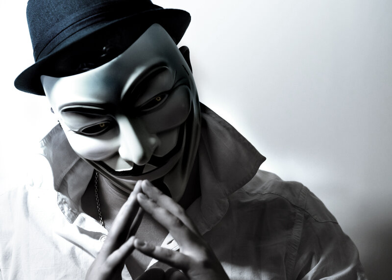 Person in Mask and Hat — Black, Dramatic