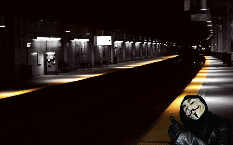 person in mask at train station
