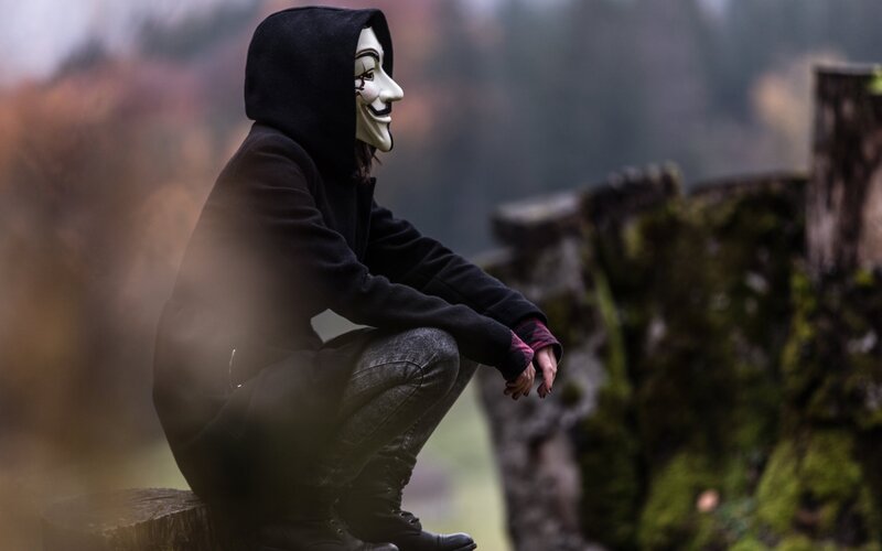 Person in Mask Crouching