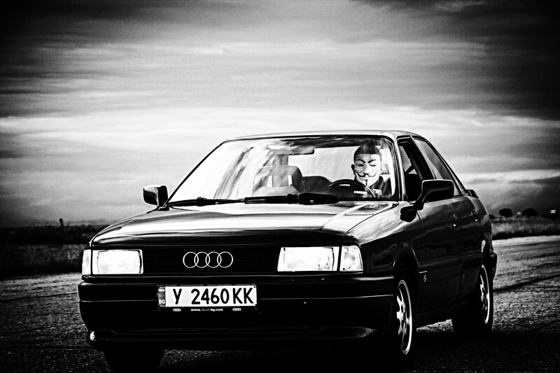 Person in Mask Driving Car