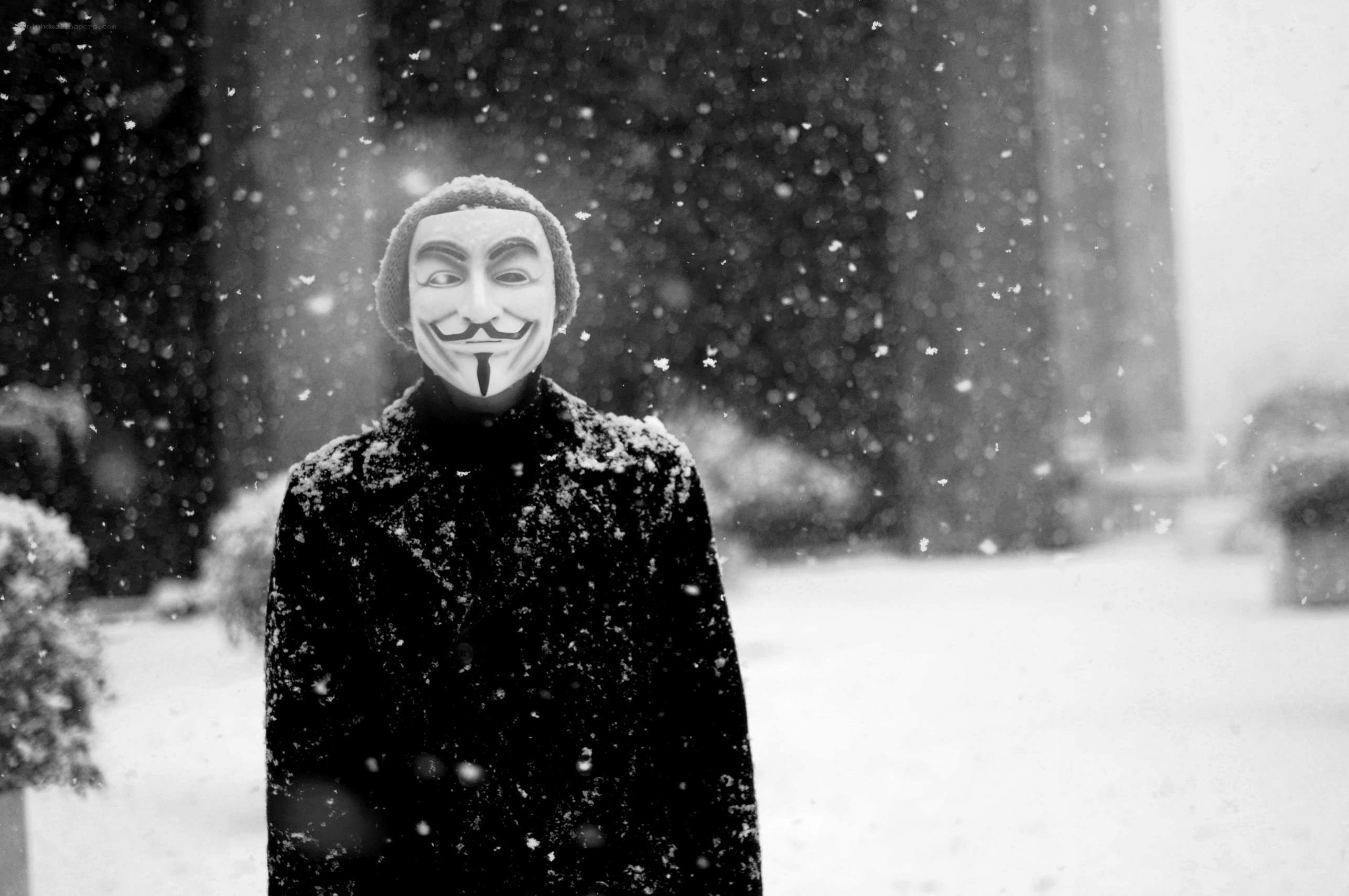 person in mask during snowfall