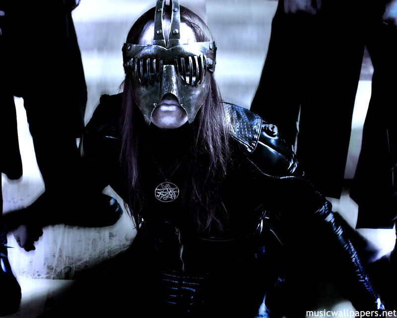 person in metal mask and black leather