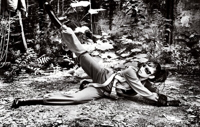 person in military gear lying on ground
