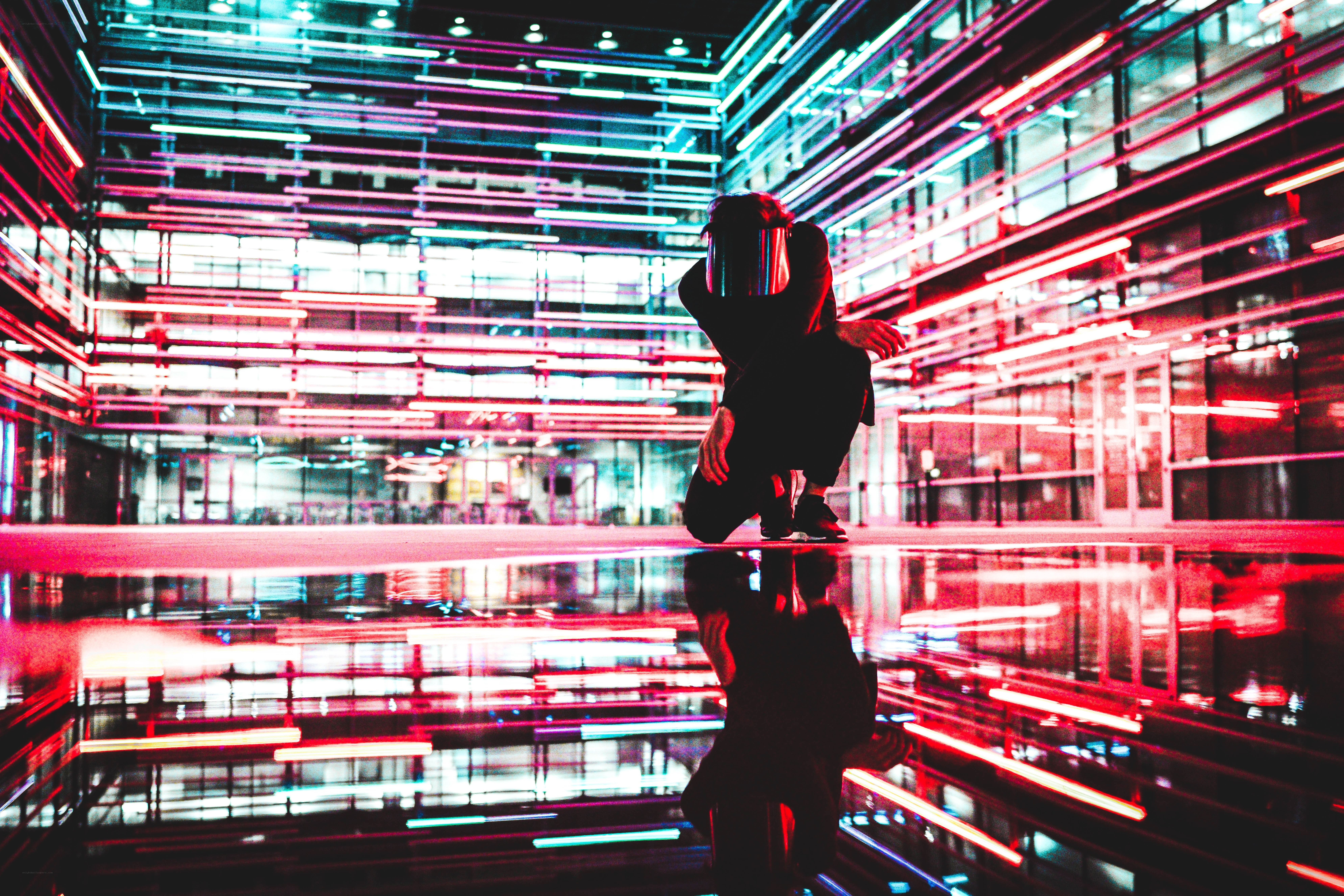person in neon-lit space