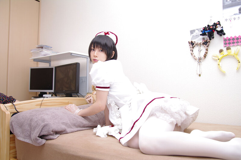 person in nurse costume on bed