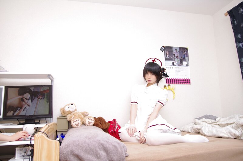 person in nurse costume on bed