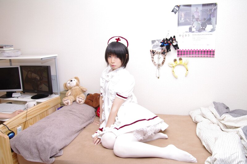 person in nurse costume on bed