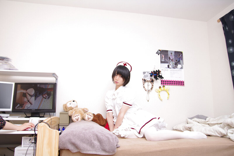 person in nurse costume on bed