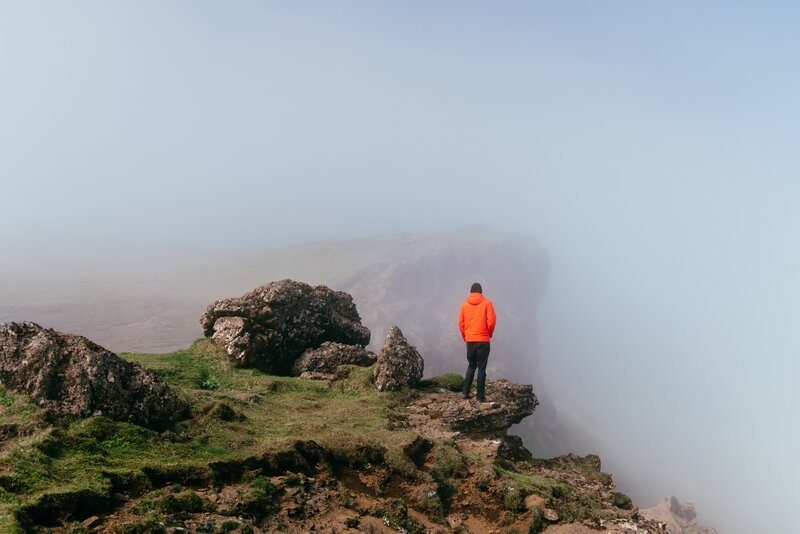 Person in Orange Jacket — Misty