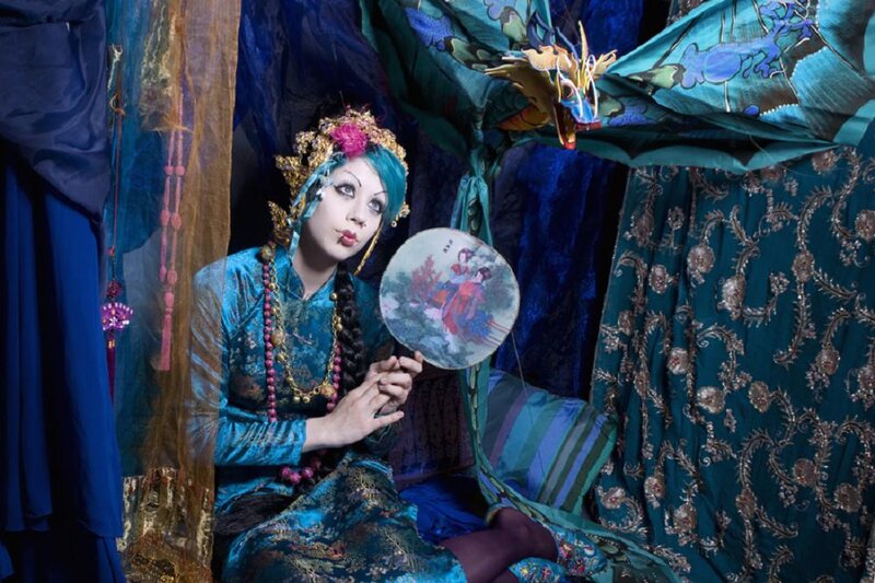 Person in Ornate Costume — Blue