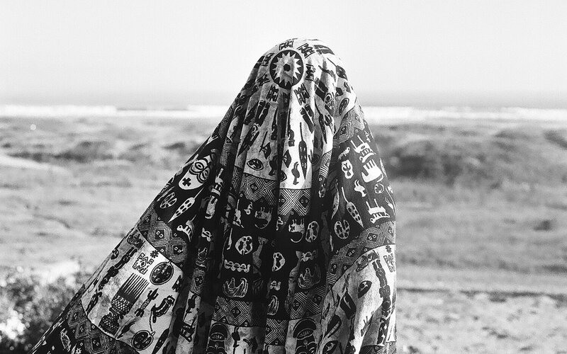 person in patterned cloth at beach