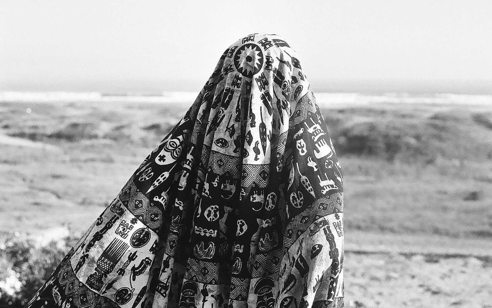 person in patterned cloth at beach